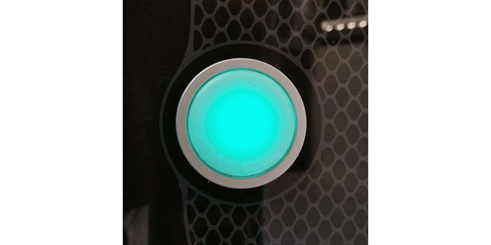 Animated image showing the Glowforge button glowing teal and then blinking teal