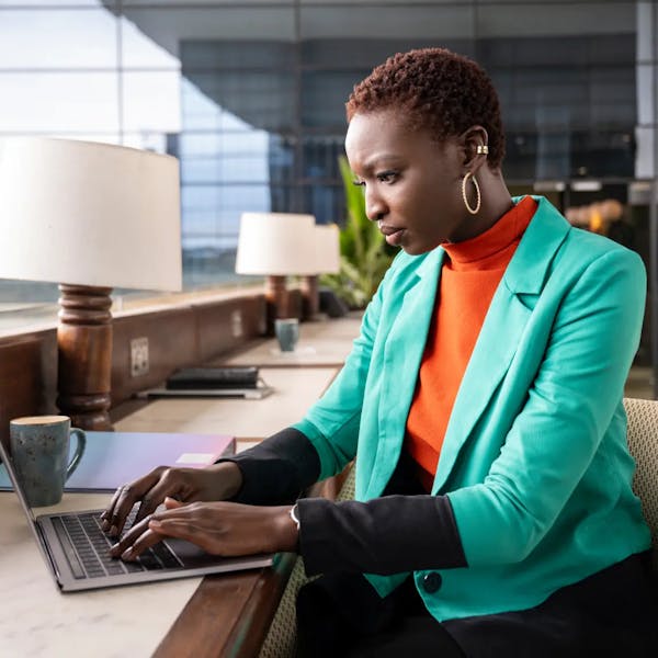 H1B Visa woman working on a computer